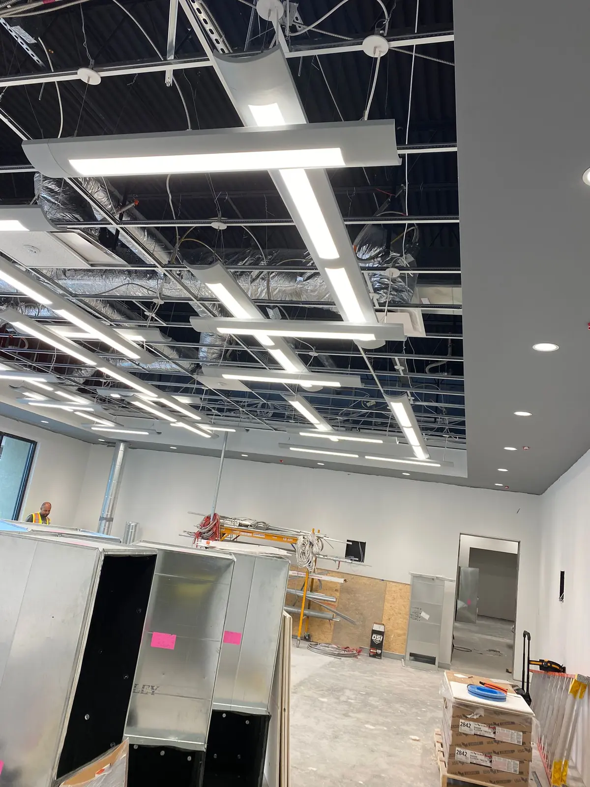 Suspended linear LED fixtures in a Charlotte office renovation
