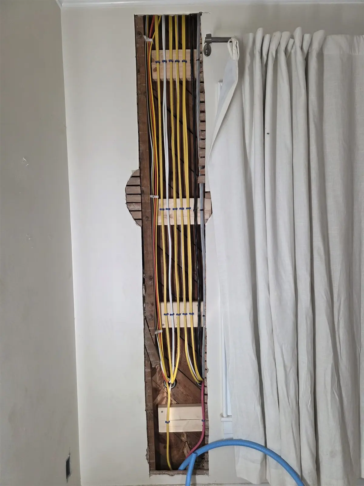 Organized new branch-circuit wiring installed in an opened wall