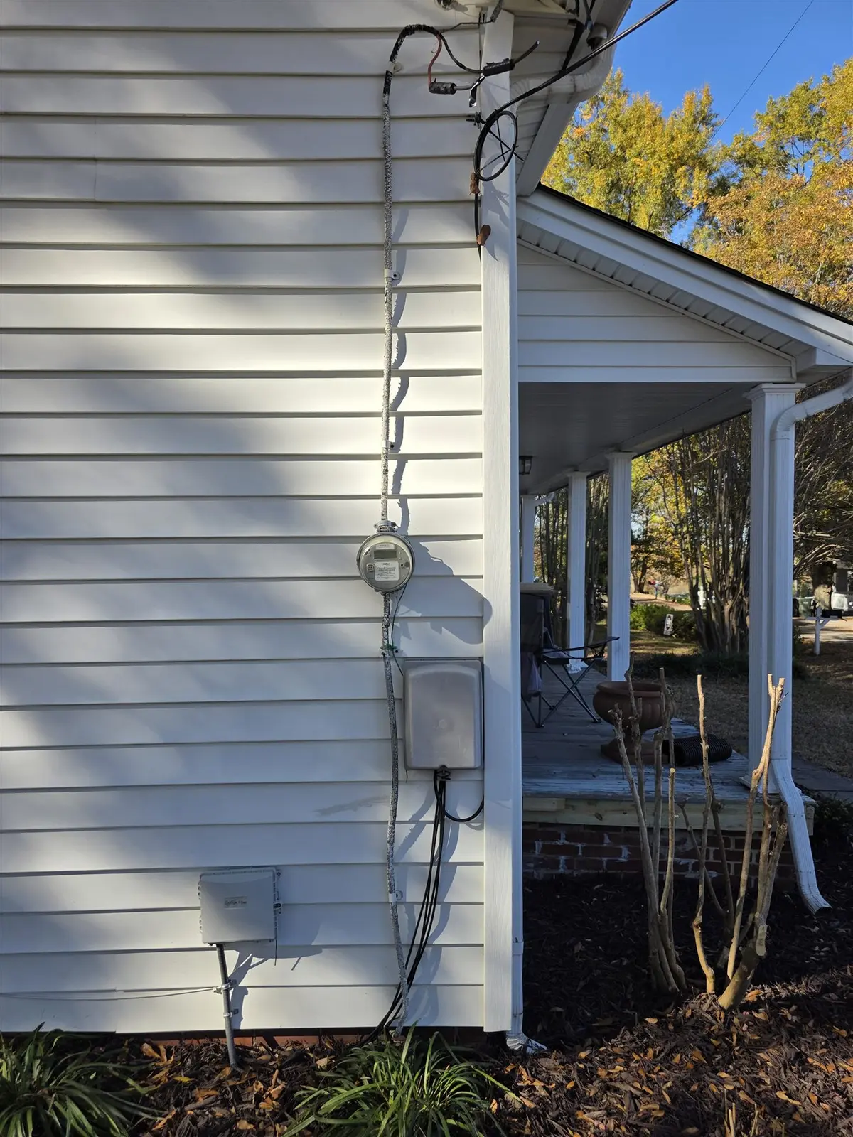 Before: outdated residential overhead electrical service and meter equipment